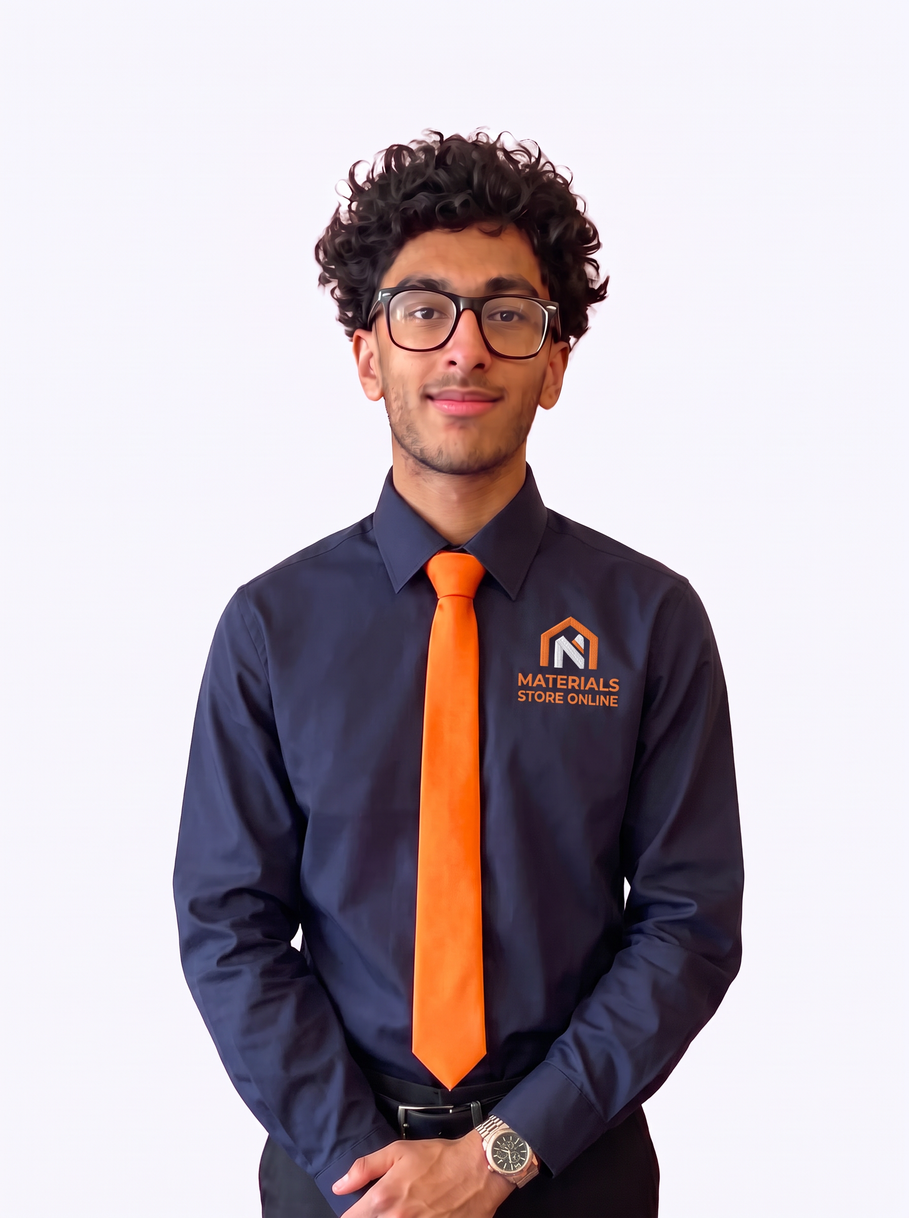 Amir, Sales Apprentice for Materials Store Online, wearing a navy MSO shirt and orange tie
